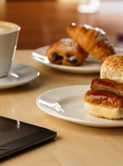 Breakfast options for meetings at Mercure hotels. Coffee, pastries and a sausage bap.