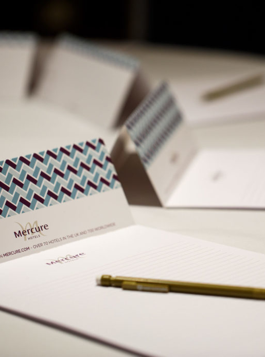 Mercure-branded notepaper set up ready for a meeting at a Mercure Hotel