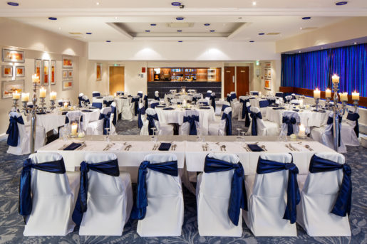 The Harewood Suite at Mercure Wetherby Hotel set up for a wedding breakfast, top table