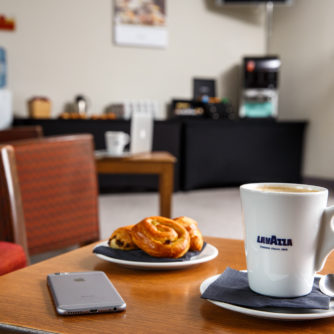 The meeting lounge area at Mercure Wetherby Hotel, coffee & pastries on table
